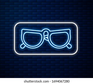 Glowing neon line Glasses icon isolated on brick wall background. Eyeglass frame symbol.  Vector Illustration