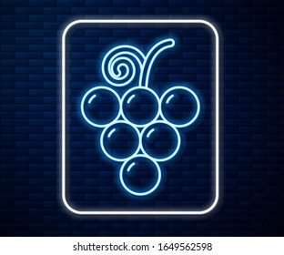 Glowing neon line Grape fruit icon isolated on brick wall background.  Vector Illustration