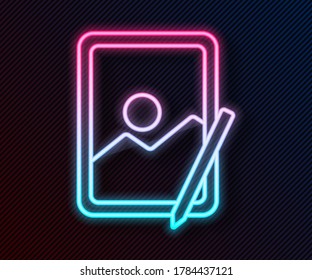 Glowing neon line Graphic tablet icon isolated on black background.  Vector Illustration