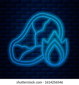 Glowing neon line Grilled steak meat and fire flame icon isolated on brick wall background.  Vector Illustration