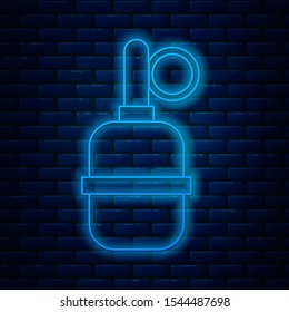 Glowing neon line Hand grenade icon isolated on brick wall background. Bomb explosion.  Vector Illustration