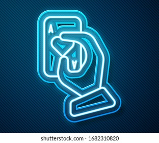 Glowing neon line Hand holding playing cards icon isolated on blue background. Casino game design.  Vector Illustration