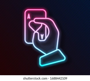 Glowing neon line Hand holding playing cards icon isolated on black background. Casino game design.  Vector Illustration