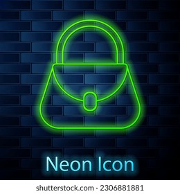 Glowing neon line Handbag icon isolated on brick wall background. Female handbag sign. Glamour casual baggage symbol.  Vector Illustration