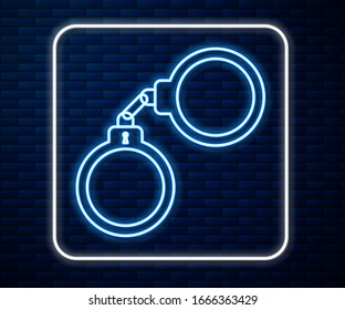 Glowing neon line Handcuffs icon isolated on brick wall background.  Vector Illustration