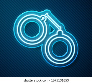 Glowing neon line Handcuffs icon isolated on blue background.  Vector Illustration