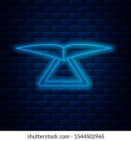 Glowing neon line Hang glider icon isolated on brick wall background. Extreme sport.  Vector Illustration