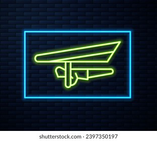 Glowing neon line Hang glider icon isolated on brick wall background. Extreme sport.  Vector Illustration