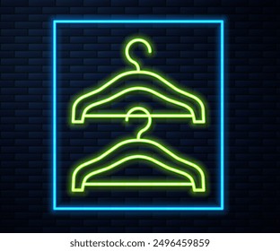 Glowing neon line Hanger wardrobe icon isolated on brick wall background. Cloakroom icon. Clothes service symbol. Laundry hanger sign.  Vector