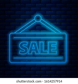 Glowing neon line Hanging sign with text Sale icon isolated on brick wall background. Signboard with text Sale.  Vector Illustration