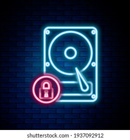 Glowing neon line Hard disk drive and lock icon isolated on brick wall background. HHD and padlock. Security, safety, protection concept. Colorful outline concept. Vector