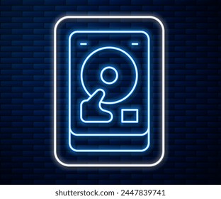 Glowing neon line Hard disk drive HDD icon isolated on brick wall background.  Vector