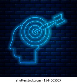Glowing neon line Head hunting concept icon isolated on brick wall background. Business target or Employment sign. Human resource and recruitment for business.  Vector Illustration