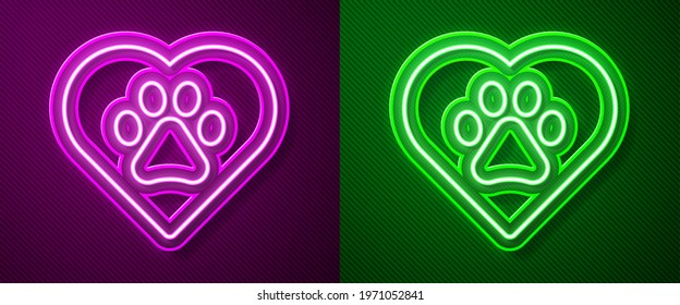 Glowing neon line Heart with animals footprint icon isolated on purple and green background. Pet paw in heart. Love to the animals.  Vector