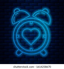 Glowing neon line Heart in the center alarm clock icon isolated on brick wall background. Valentines day.  Vector Illustration