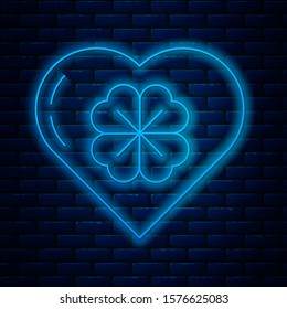 Glowing neon line Heart with four leaf clover icon isolated on brick wall background. Happy Saint Patrick day.  Vector Illustration