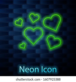 Glowing neon line Heart icon isolated on brick wall background. Romantic symbol linked, join, passion and wedding. Valentine day symbol.  Vector Illustration