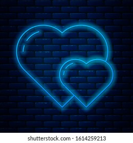 Glowing neon line Heart icon isolated on brick wall background. Romantic symbol linked, join, passion and wedding. Valentine day symbol.  Vector Illustration