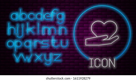 Glowing neon line Heart on hand icon isolated on brick wall background. Hand giving love symbol. Valentines day symbol. Neon light alphabet. Vector Illustration