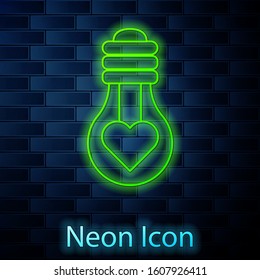 Glowing neon line Heart shape in a light bulb icon isolated on brick wall background. Love symbol. Valentine day symbol.  Vector Illustration