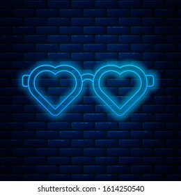 Glowing neon line Heart shaped love glasses icon isolated on brick wall background. Suitable for Valentine day card design.  Vector Illustration