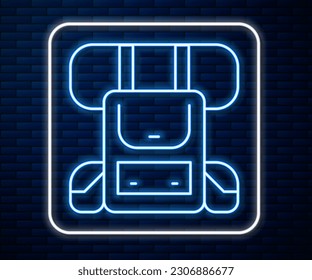 Glowing neon line Hiking backpack icon isolated on brick wall background. Camping and mountain exploring backpack.  Vector