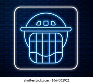 Glowing neon line Hockey helmet icon isolated on brick wall background.  Vector Illustration