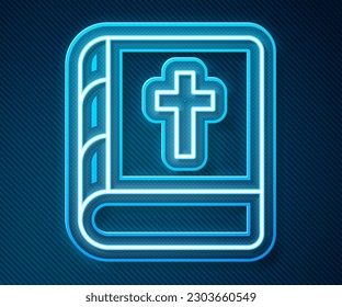 Glowing neon line Holy bible book icon isolated on blue background.  Vector