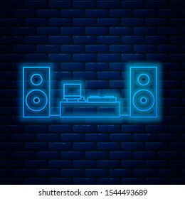 Glowing neon line Home stereo with two speaker s icon isolated on brick wall background. Music system.  Vector Illustration