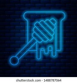 Glowing neon line Honey dipper stick with dripping honey icon isolated on brick wall background. Honey ladle.  Vector Illustration