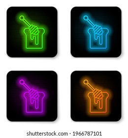 Glowing neon line Honey dipper stick with dripping honey icon isolated on white background. Honey ladle. Black square button. Vector