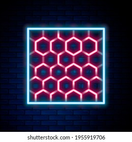 Glowing neon line Honeycomb icon isolated on brick wall background. Honey cells symbol. Sweet natural food. Colorful outline concept. Vector