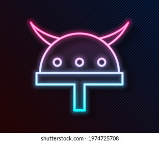 Glowing neon line horned Viking helmet icon isolated on black background.  Vector