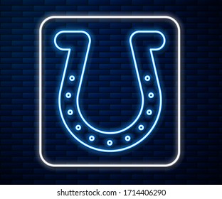 Glowing neon line Horseshoe icon isolated on brick wall background.  Vector Illustration