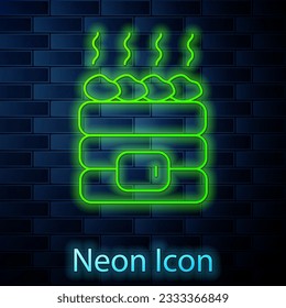 Glowing neon line Hot sauna stones icon isolated on brick wall background. Spa resort recreation, bathhouse relaxation. Hot stones on electric heater.  Vector