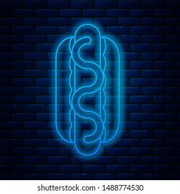 Glowing neon line Hotdog sandwich with mustard icon isolated on brick wall background. Sausage icon. Street fast food menu.  Vector Illustration