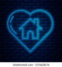 Glowing neon line House with heart shape icon isolated on brick wall background. Love home symbol. Family, real estate and realty.  Vector Illustration