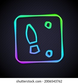 Glowing neon line Human footprints shoes icon isolated on black background. Shoes sole.  Vector