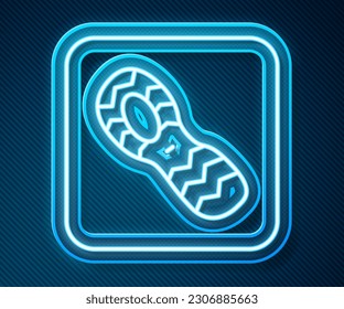 Glowing neon line Human footprints shoes icon isolated on blue background. Shoes sole.  Vector