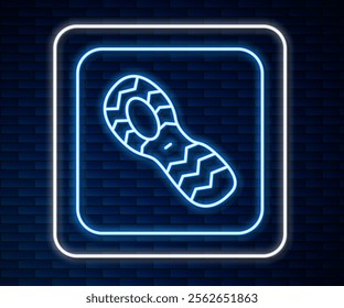 Glowing neon line Human footprints shoes icon isolated on brick wall background. Shoes sole.  Vector