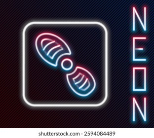 Glowing neon line Human footprints shoes icon isolated on black background. Shoes sole. Colorful outline concept. Vector