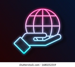Glowing neon line Human hand holding Earth globe icon isolated on black background. Save earth concept.  Vector Illustration