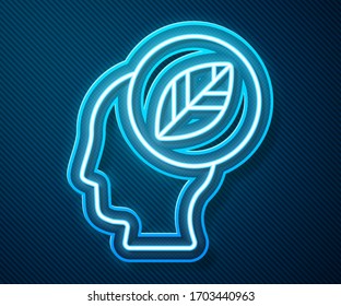 Glowing neon line Human head with leaf inside icon isolated on blue background.  Vector Illustration