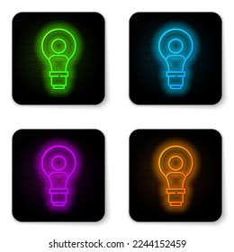 Glowing neon line Human head with lamp bulb icon isolated on white background. Black square button. Vector