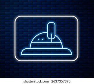 Glowing neon line Hunter hat icon isolated on brick wall background. Plaid winter hat.  Vector