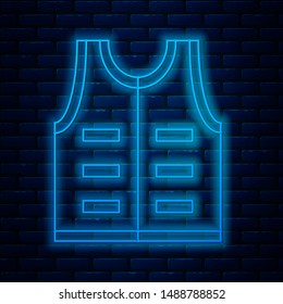 Glowing neon line Hunting jacket icon isolated on brick wall background. Hunting vest.  Vector Illustration