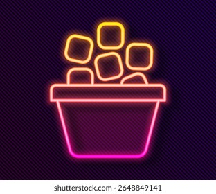 Glowing neon line Ice bucket filled with ice cubes icon isolated on black background.  Vector