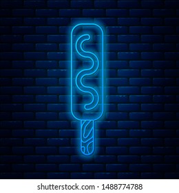 Glowing neon line Ice cream icon isolated on brick wall background. Sweet symbol.  Vector Illustration