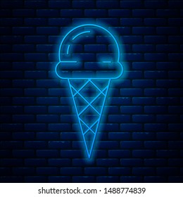 Glowing neon line Ice cream in waffle cone icon isolated on brick wall background. Sweet symbol.  Vector Illustration