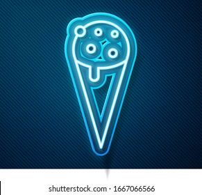 Glowing neon line Ice cream in waffle cone icon isolated on blue background. Sweet symbol.  Vector Illustration
